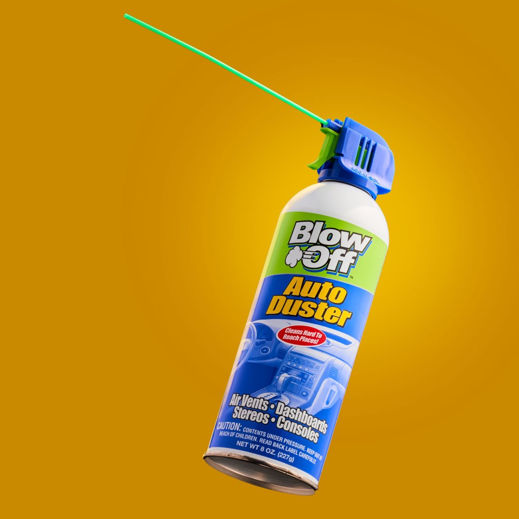 Image of a can of Blow Off Auto Duster on a golden background.